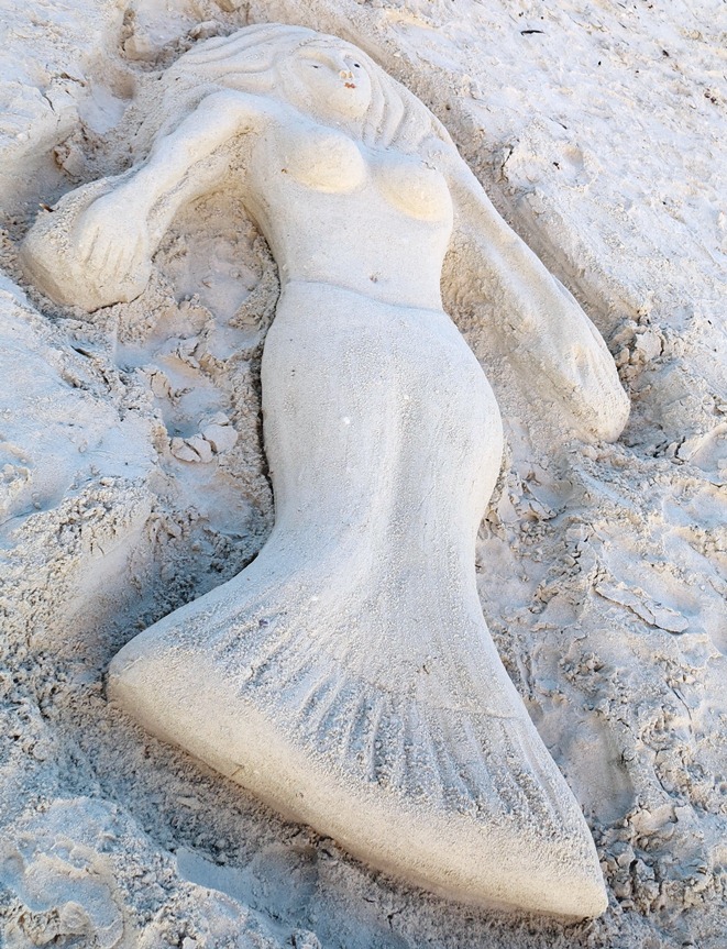 Meerjungfrau am Strand